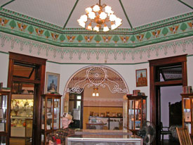 Great room, featuring spindled archways.